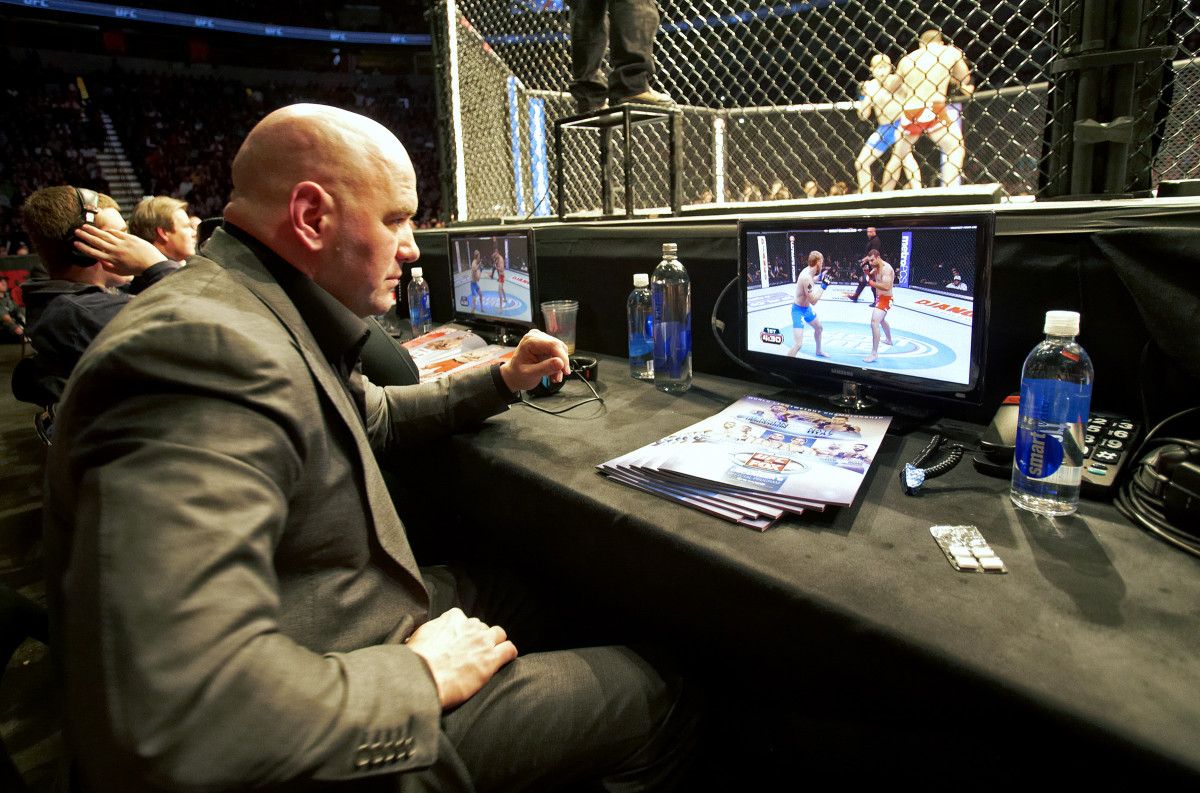 White, cage-side, in 2012.
